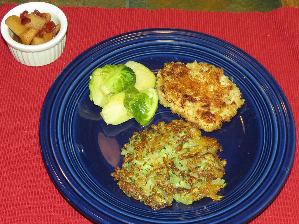Jägerschnitzel and zucchini/potato pancakes with Brussels sprouts and apple compoté