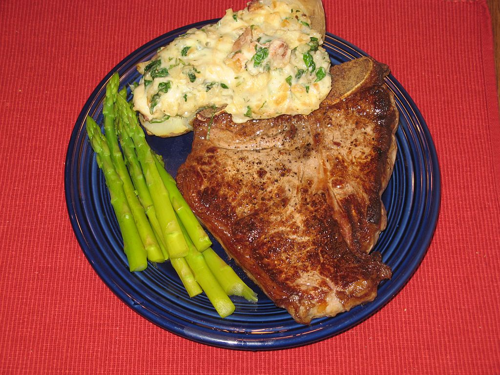 T-bone Steak and Danish stuffed potatoes with asparagus